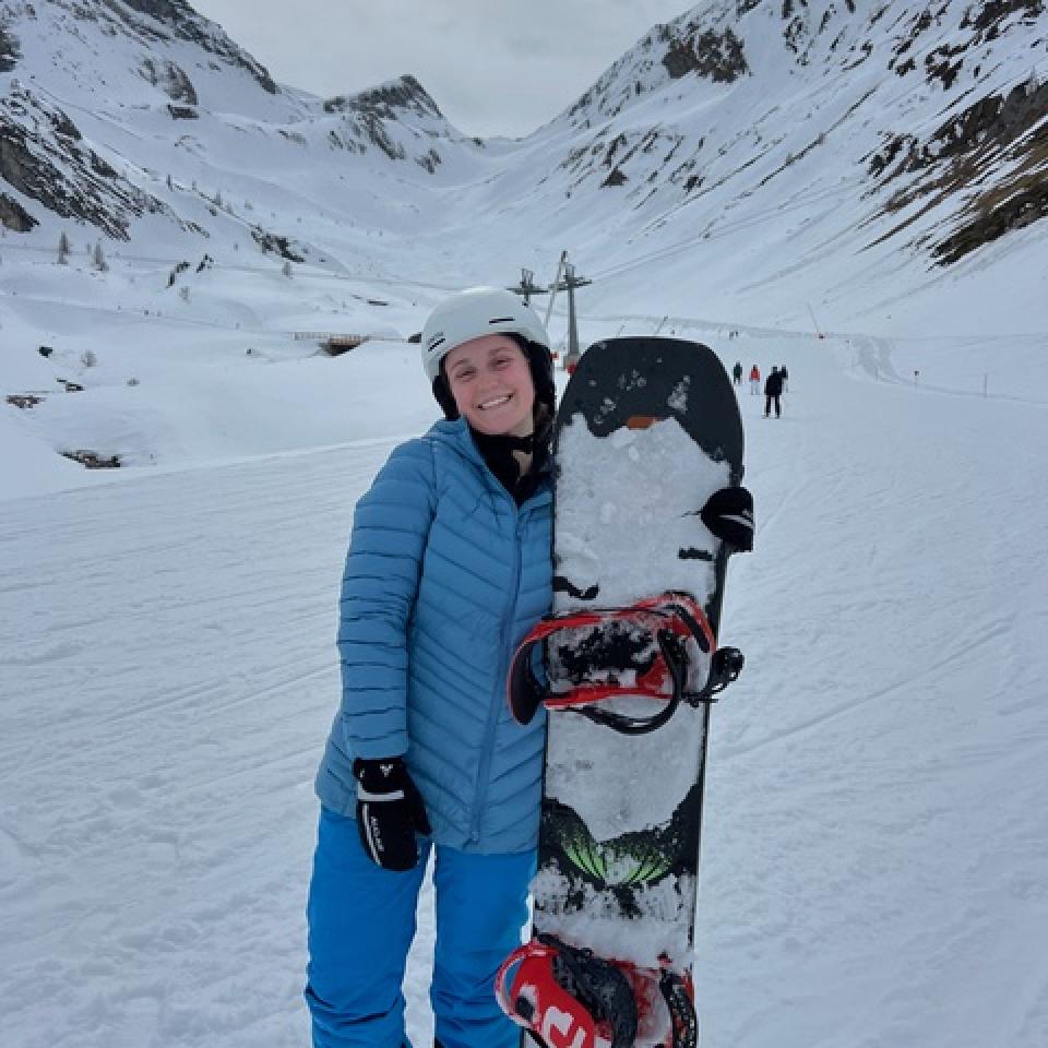 Gia Levis poses with her snowboard among Austrian glaciers at Hintertux.