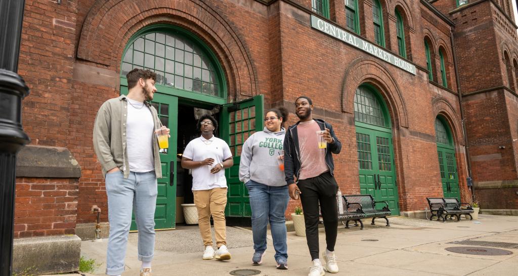 Students walking outside of Central Market in downtown York.