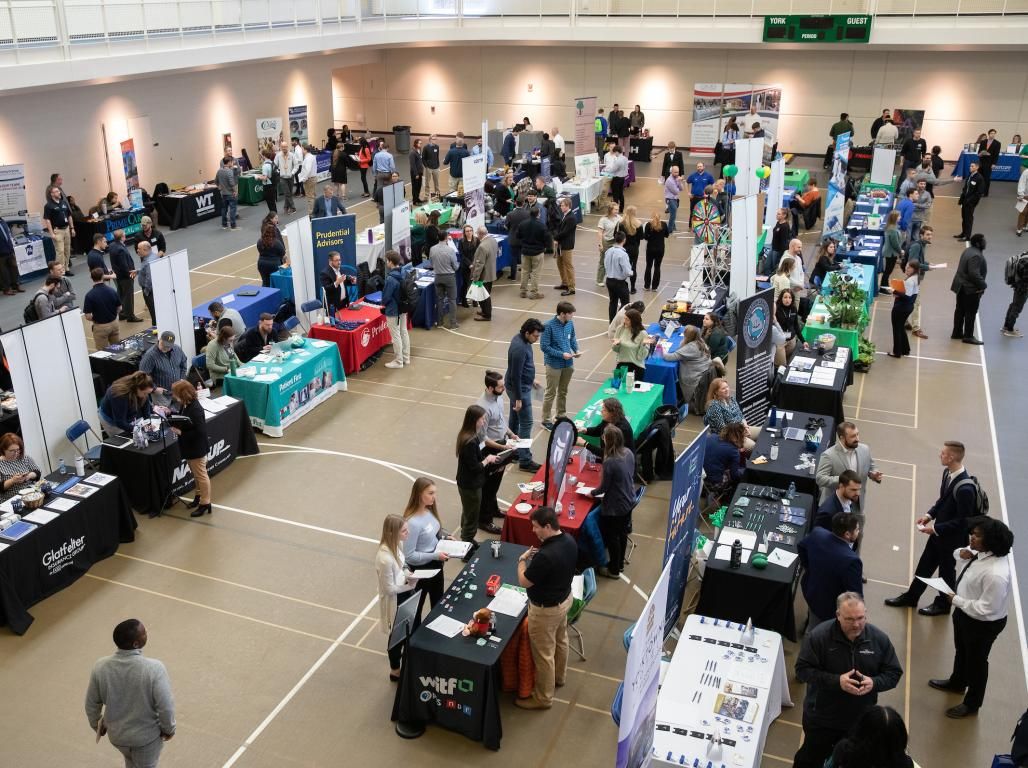 An aerial photo from the Career Expo of employer tables in the Grumbacher gym.