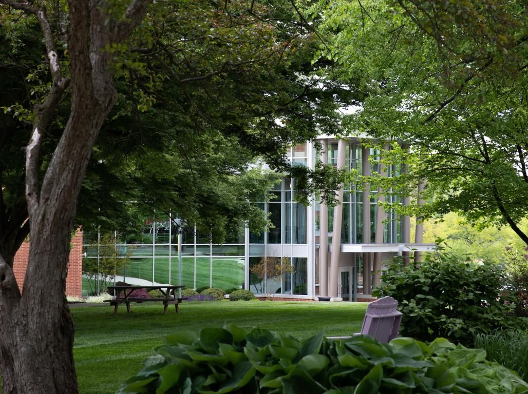 A look at the WPAC through the greenery on main campus.