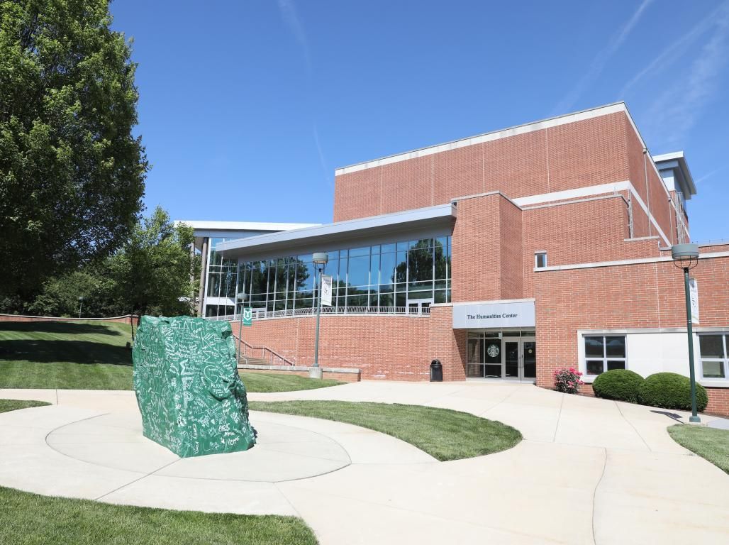 Exterior photo of the Humanities Center and the Rock.