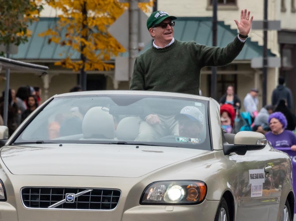 President Thomas Burns waves to the crowd standing in car during the 73rd Annual York Halloween Parade.