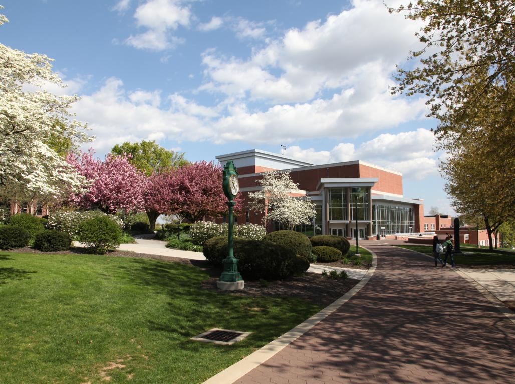 Outside shot of campus looking down the pathway to the Walder Performing Arts Center.