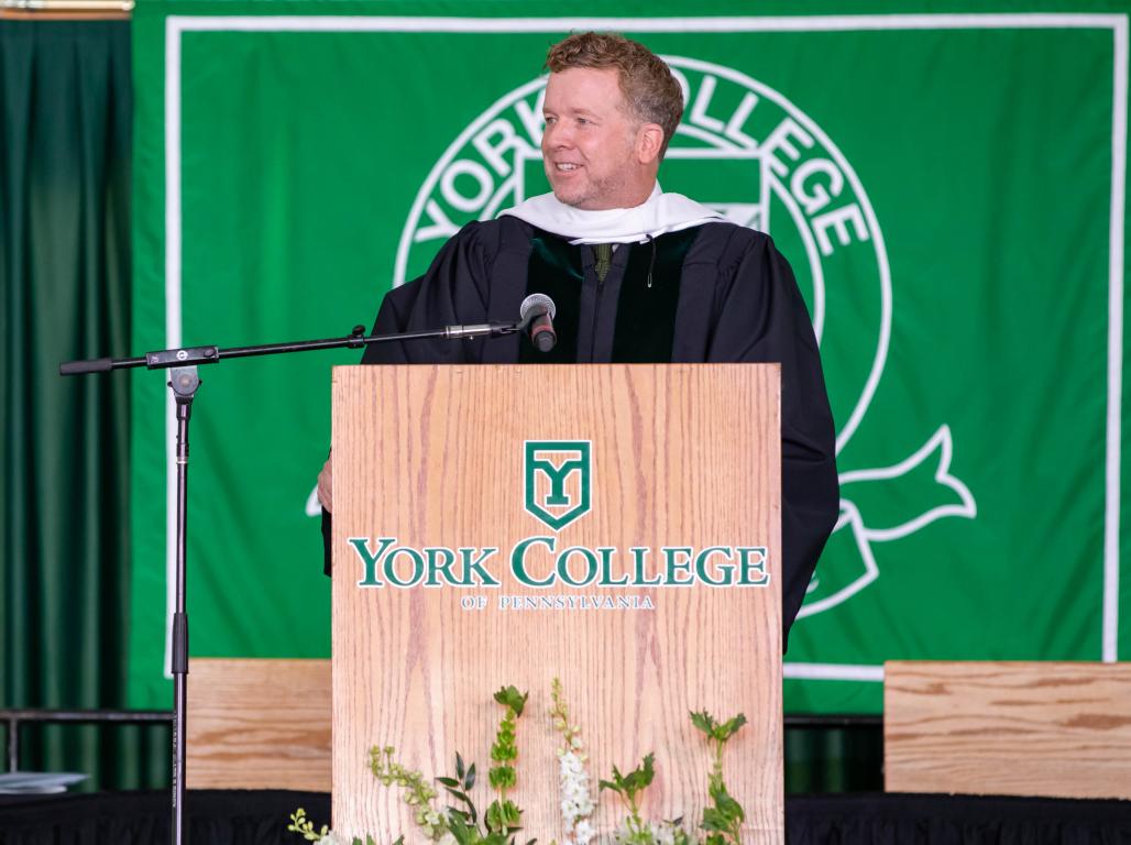 McG giving a speech during the 2022 spring commencement 