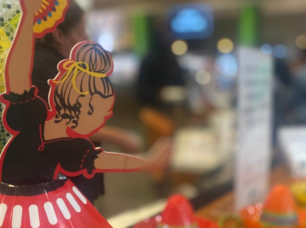 Decorations on the table during Johnson Dining Hall's Hispanic Heritage Dinner feature miniature flags from spanish-speaking countries and small favors in the shape of sombreros, folk dancers, and more.