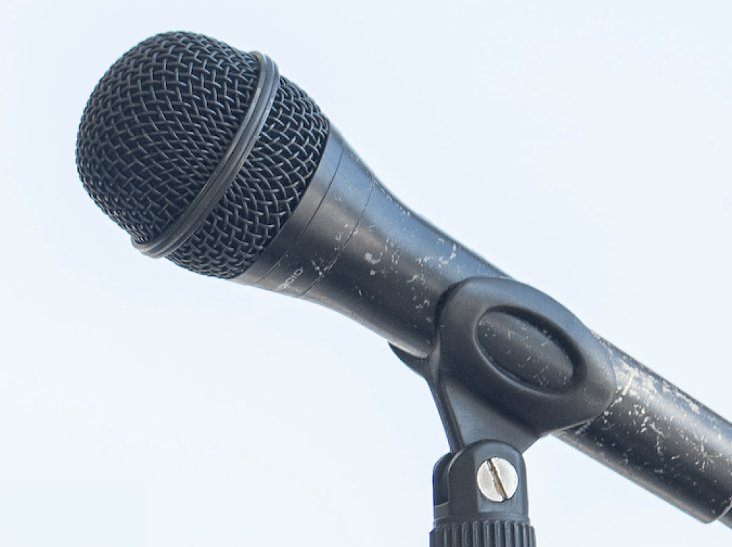 A close-up of a microphone on a mic stand 