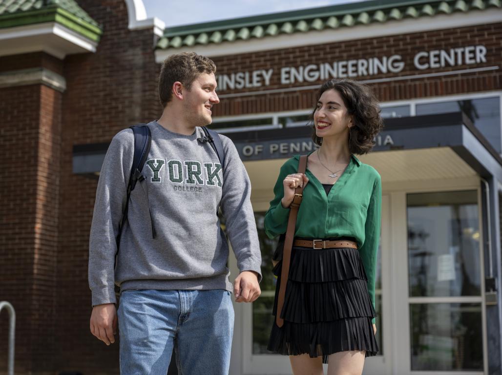 Two students walking out of the Kinsley Engineering Center