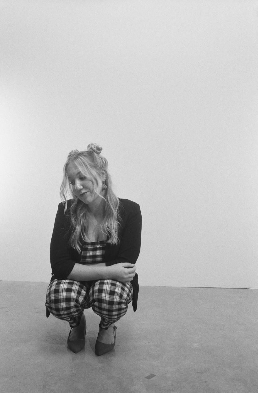 Chloe Ament poses in a moody black and white image.