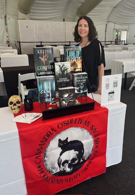 Dr. Cassandra O’Sullivan Sachar ‘99 showcasing her books at an event.