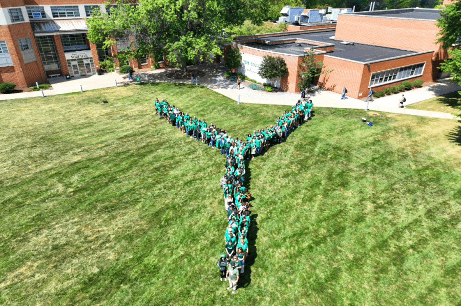 An aerial view shows York College students and employees wearing green arranged in the shape of a giant “Y” on the Main Lawn.