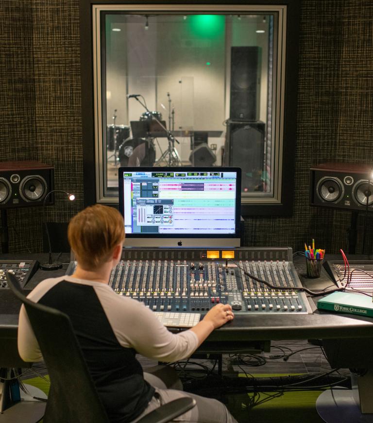 A student in the recording studio.