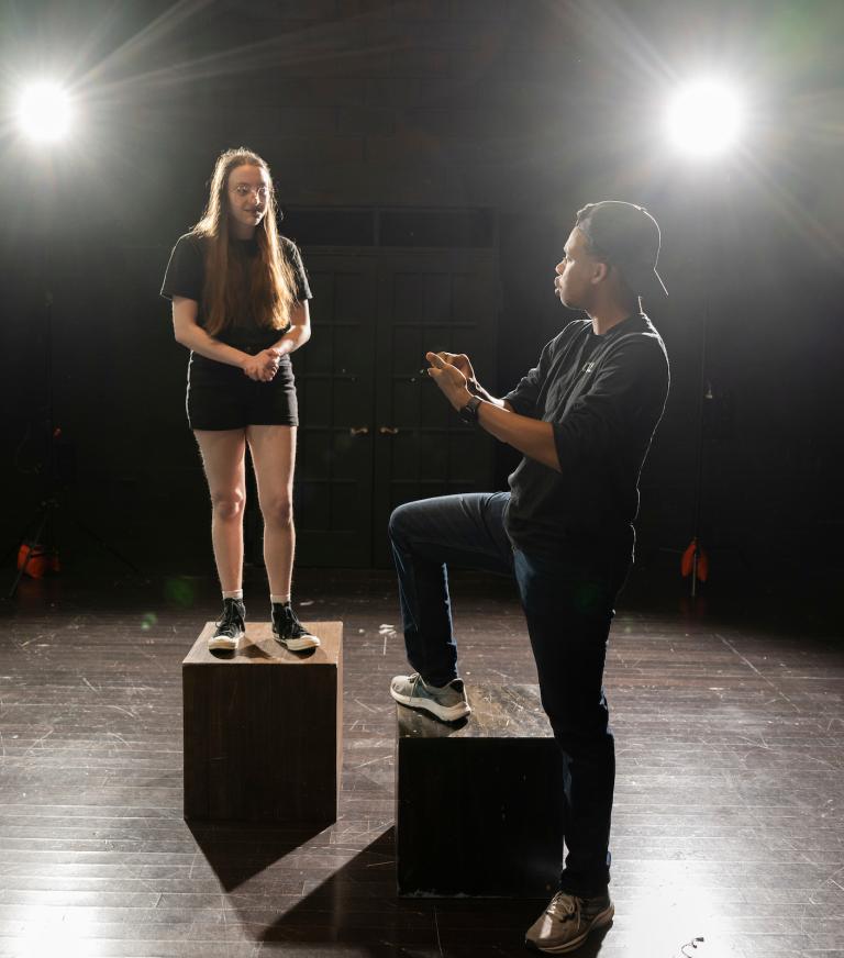 Two theatre students acting out a scene