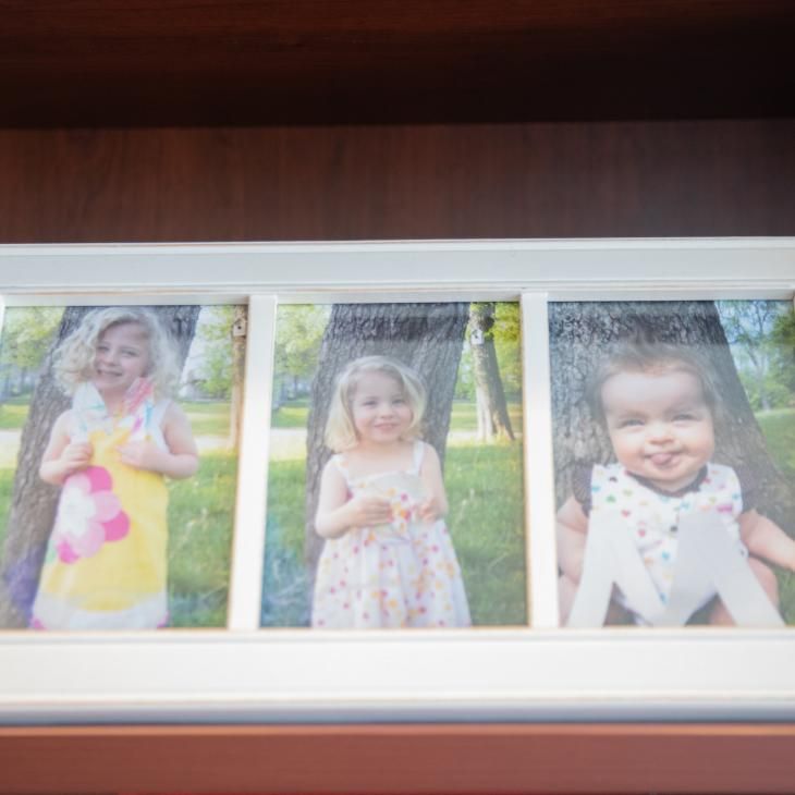 A triple frame holds three photos of Molly Sauder's daughters.