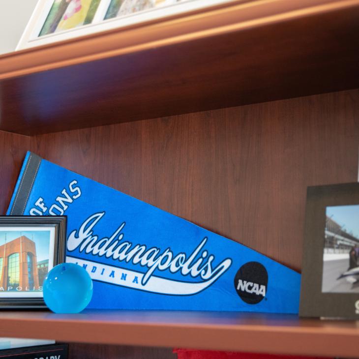 A blue Indianapolis pennant sits on a shelf.