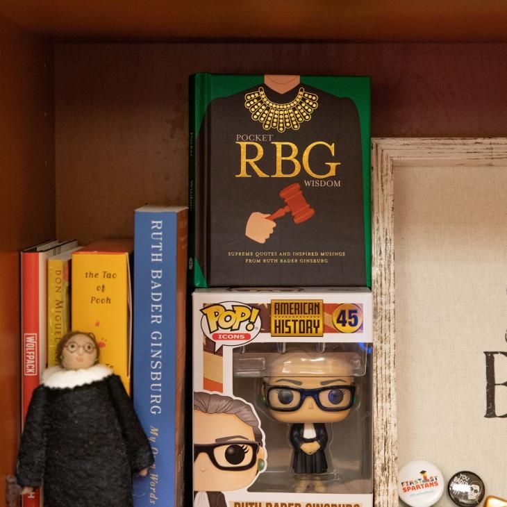 A pop figurine of Ruth Bader Ginsburg dressed in judge's black robe and white collar..