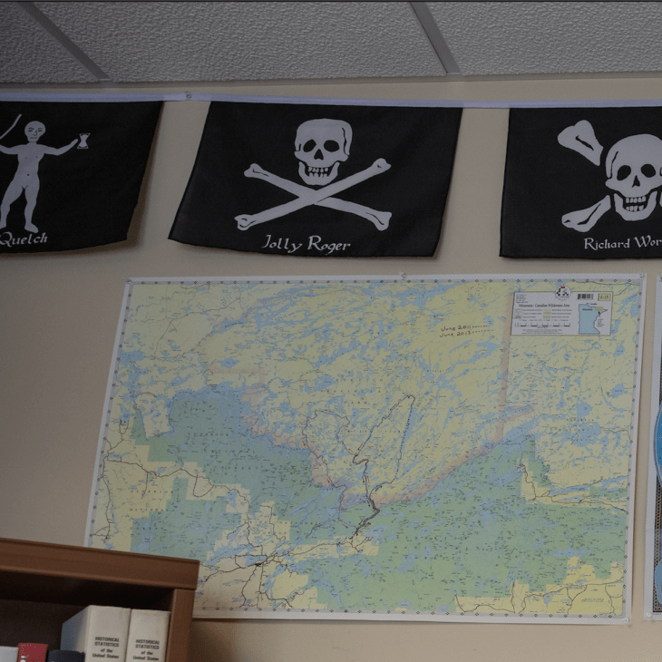 Pirate flags hanging in John Altman's office space.