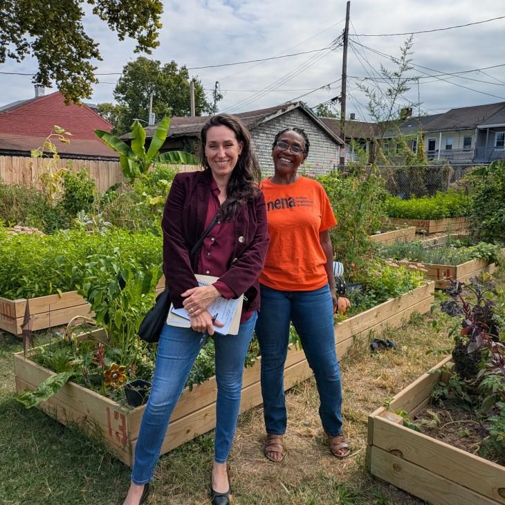 Jess Zartman, Director of the Urban Collaborative, and community partner Ms. Darlene at the Northeast Neighborhood Association Community Garden.