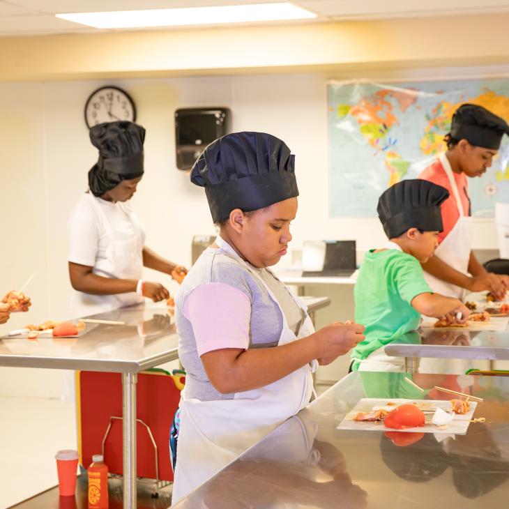 Cooking Up Connection participants preparing food.