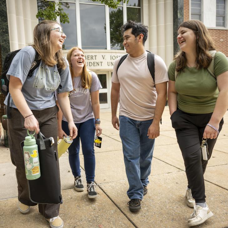 Students walking in front of the student union building.