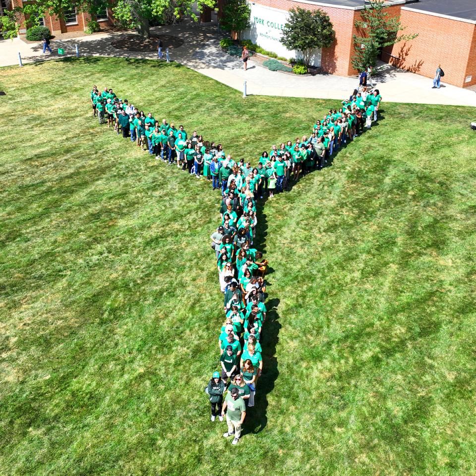 The YCP community forms a large letter Y on the main campus. Photo seen from a drone shot above